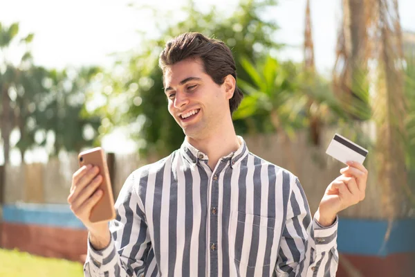 Young Handsome Man Buying Mobile Credit Card — Stock Photo, Image