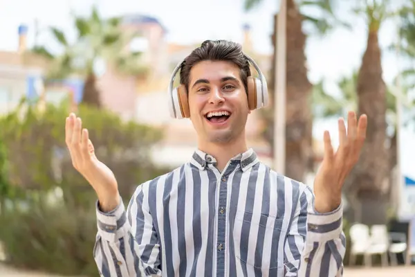 Young Handsome Man Surprised Listening Music — Stock Photo, Image