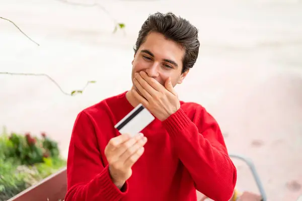 Young Handsome Man Holding Credit Card Surprised Expression — Stock Photo, Image