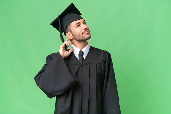 Young University Graduate Man Isolated Background Thinking Idea — Stock Photo, Image