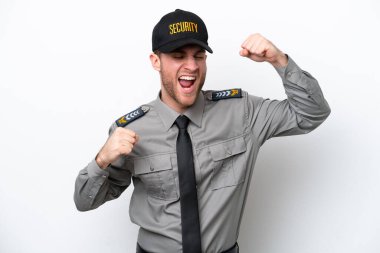 Young safeguard caucasian man isolated on white background celebrating a victory