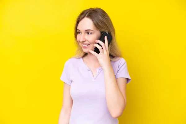 Blonde English Young Girl Isolated Yellow Background Keeping Conversation Mobile — Stock Photo, Image