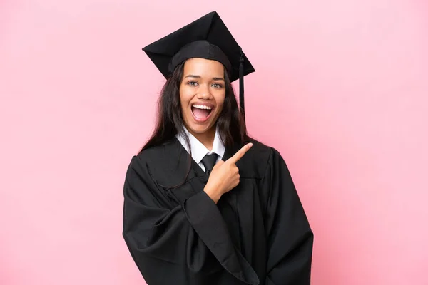 Young University Colombian Woman Graduate Isolated Pink Background Surprised Pointing — Foto de Stock