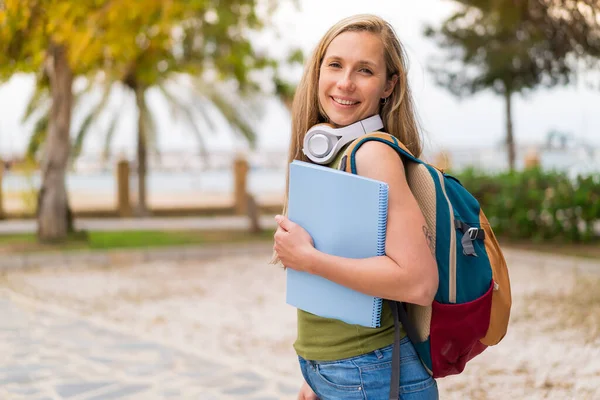 Young Blonde Woman Outdoors Holding Notebook Happy Expression — Stock Photo, Image