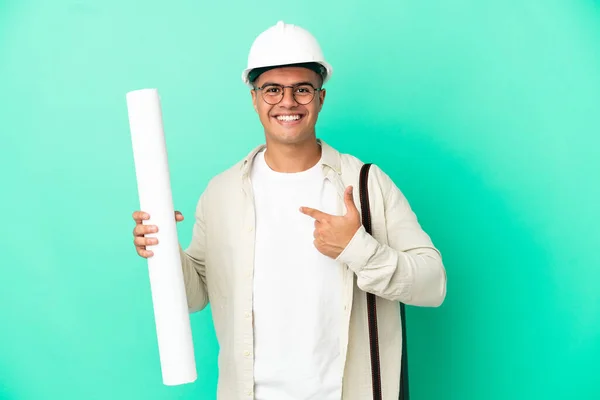 Young Architect Man Holding Blueprints Isolated Background Surprise Facial Expression — Stok fotoğraf