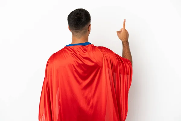 Super Hero Geïsoleerde Witte Achtergrond Wijzend Terug Met Wijsvinger — Stockfoto