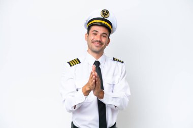 İzole edilmiş beyaz arka plan üzerinde uçak pilotu bir konferansta sunumdan sonra alkışlıyor