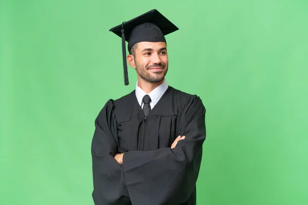 Young University Graduate Man Isolated Background Arms Crossed Looking Forward — Stock Photo, Image
