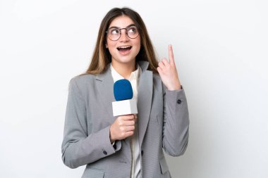 Young caucasian TV presenter woman isolated on white background thinking an idea pointing the finger up