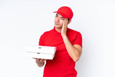 Pizza delivery caucasian man with work uniform picking up pizza boxes isolated on white background with headache