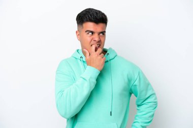 Young caucasian handsome man isolated on white background nervous and scared