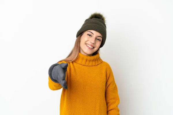 Ung Flicka Med Vinter Hatt Isolerad Vit Bakgrund Skakar Hand — Stockfoto