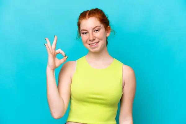 Young Reddish Woman Isolated Blue Background Showing Sign Fingers — Zdjęcie stockowe