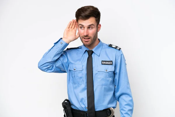 Young Police Caucasian Man Isolated White Background Listening Something Putting — Stockfoto