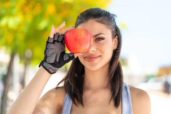 Young Pretty Sport Woman Outdoors Holding Apple Happy Expression — Stock Photo, Image