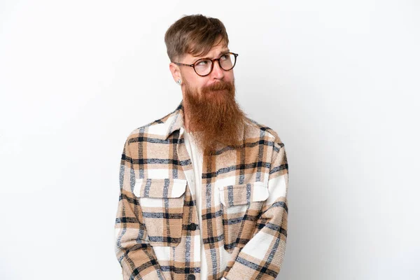 Redhead Man Long Beard Isolated White Background Having Doubts While — Fotografia de Stock