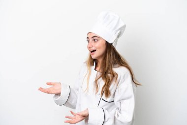 Young caucasian chef woman isolated on white background with surprise facial expression