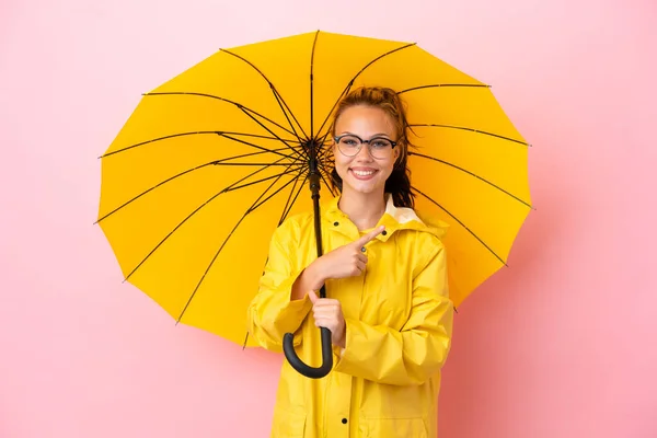 Teenager Russian Girl Rainproof Coat Umbrella Isolated Pink Background Pointing — Stock Photo, Image