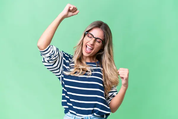 stock image Young Uruguayan woman over isolated background celebrating a victory