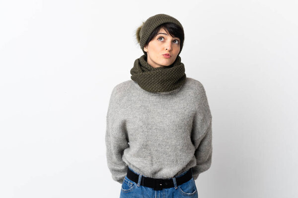Young girl with winter hat and looking up