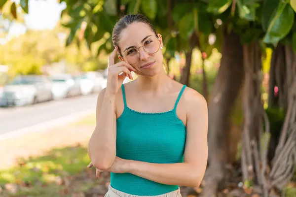 Young Pretty Woman Glasses Outdoors Having Doubts — Stock Photo, Image