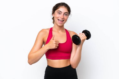 Young sport caucasian woman making weightlifting isolated on white background giving a thumbs up gesture