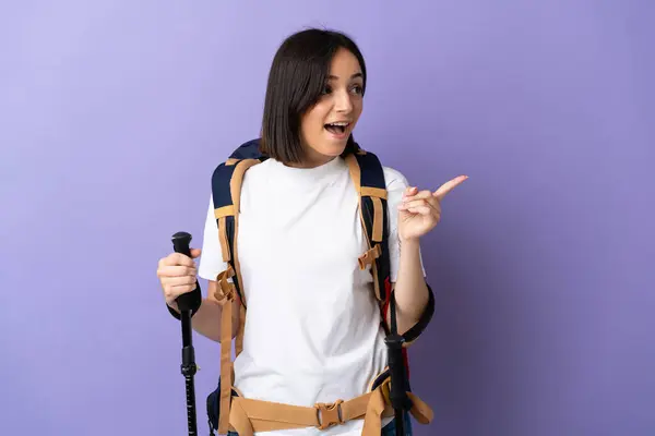 Young Caucasian Woman Backpack Trekking Poles Isolated Blue Background Intending — Stock Photo, Image
