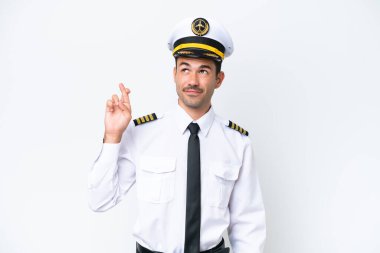 İzole edilmiş beyaz arka plan üzerinde uçağın pilotu şans diliyor ve en iyisini diliyor.