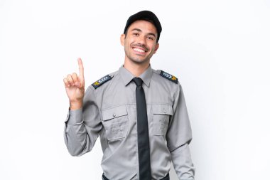 İzole edilmiş beyaz arka planda genç güvenlik görevlisi en iyinin işareti olarak parmağını kaldırıyor ve gösteriyor.
