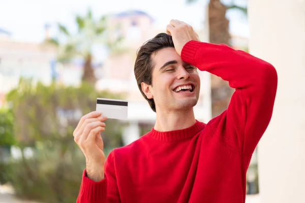 Young Handsome Man Holding Credit Card Outdoors Has Realized Something — Stock Photo, Image