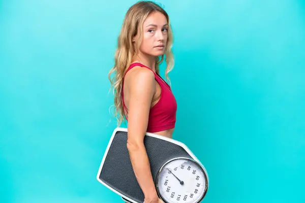 Young Russian Woman Isolated Blue Background Weighing Machine — Stock Photo, Image