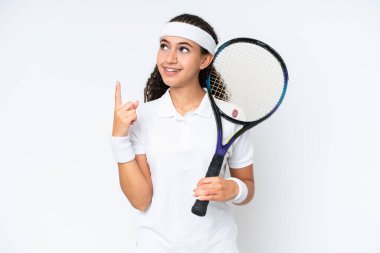 Young tennis player woman isolated on white background pointing up a great idea