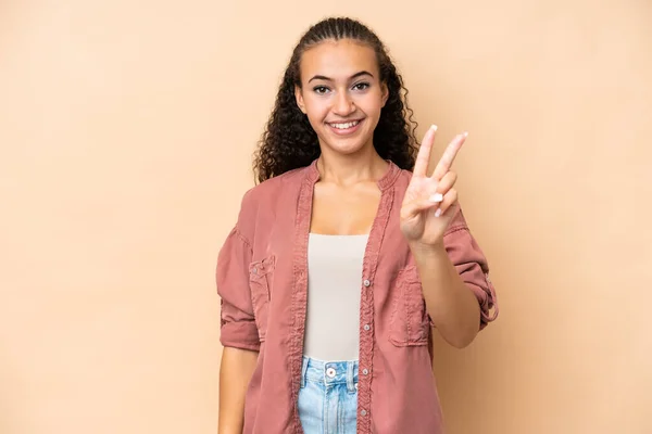Young Woman Isolated Beige Background Smiling Showing Victory Sign —  Fotos de Stock