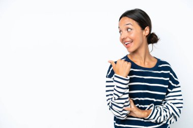 Young hispanic woman isolated on white background pointing to the side to present a product