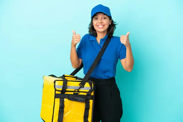 Young delivery woman with thermal backpack with thumbs up gesture and smiling