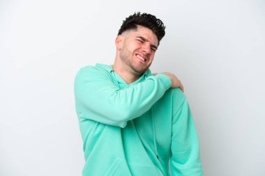 Young caucasian man isolated on white background suffering from pain in shoulder for having made an effort