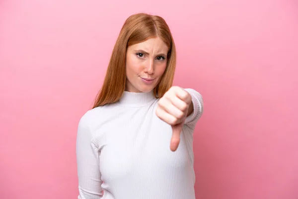 Young Redhead Woman Isolated Pink Background Showing Thumb Negative Expression — Stock Photo, Image
