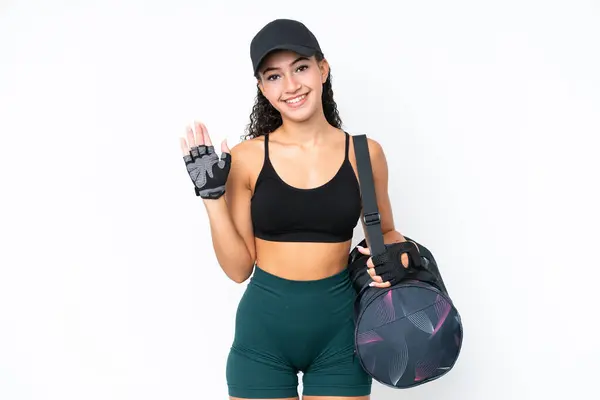 Young Sport Woman Sport Bag Isolated White Background Saluting Hand — Stock Photo, Image