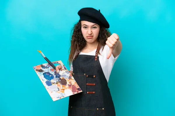 Jovem Artista Árabe Mulher Segurando Uma Paleta Isolada Fundo Azul — Fotografia de Stock