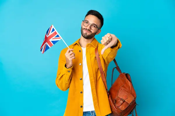 Young Caucasian Man Holding United Kingdom Flag Isolated Yellow Background — Stock Photo, Image