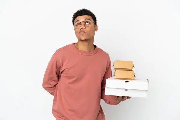 Young African American Man Holding Burger Pizzas Isolated White Background — Stock Photo, Image