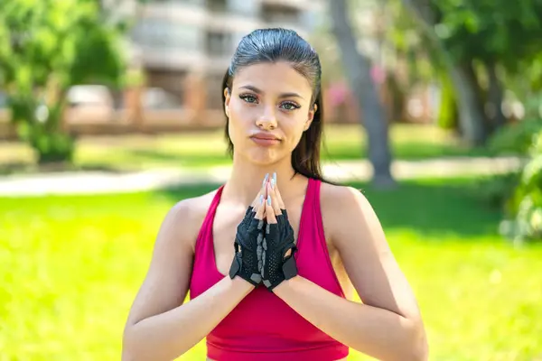 Young Pretty Sport Woman Outdoors Keeps Palm Together Person Asks — Stock Photo, Image
