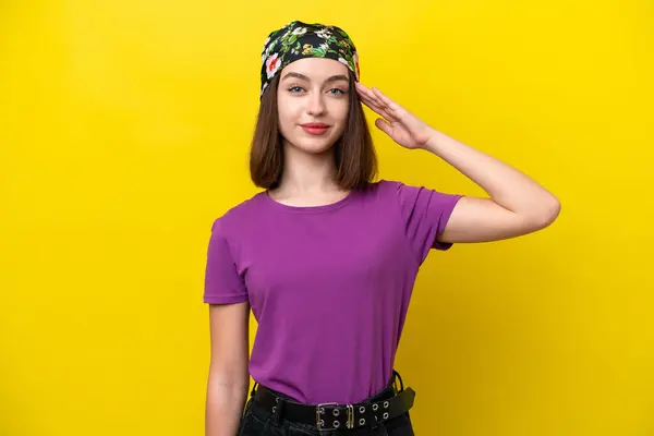 Young Ukrainian Woman Isolated Yellow Background Saluting Hand Happy Expression — Stock Photo, Image