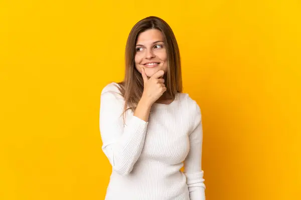 Young Slovak Woman Isolated Yellow Background Looking Side Smiling — Stock Photo, Image