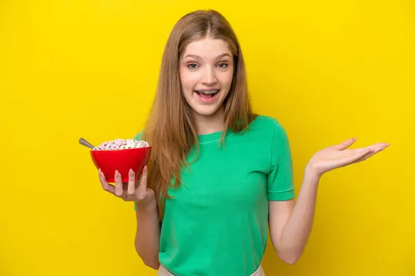 Teenager Russian Girl Holding Bowl Cereals Isolated Yellow Background Shocked — Stock Photo, Image