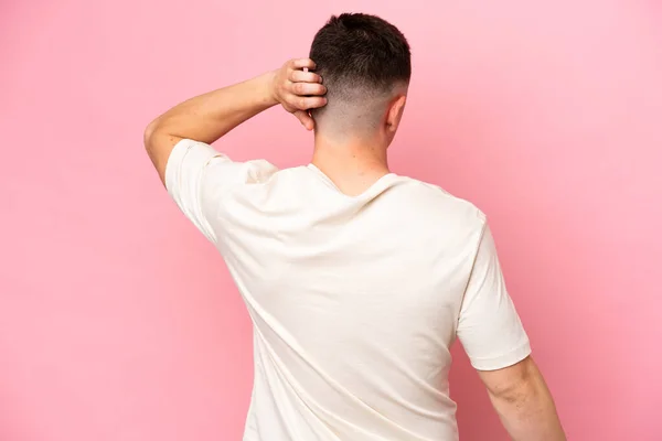 Young Brazilian Man Isolated Pink Background Back Position Thinking — Stock Photo, Image