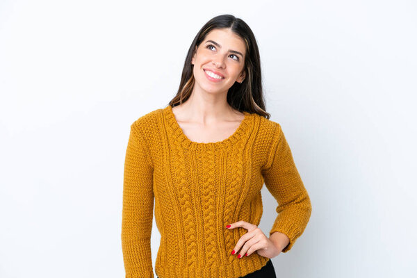 Young Italian woman isolated on white background thinking an idea while looking up