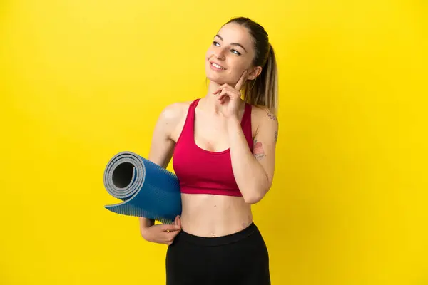 Young Sport Woman Going Yoga Classes While Holding Mat Thinking — Foto de Stock