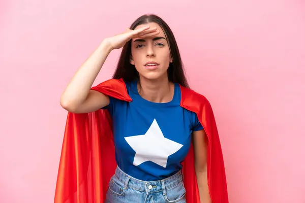 Super Hero Caucasian Woman Isolated Pink Background Looking Far Away — Stock Photo, Image