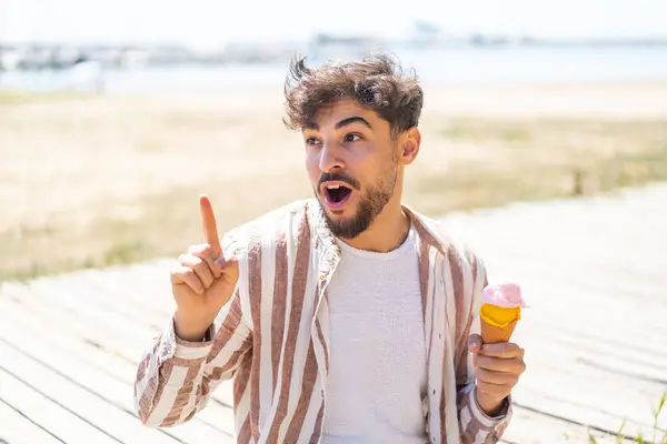 Handsome Arab Man Cornet Ice Cream Outdoors Intending Realizes Solution — Stock Photo, Image